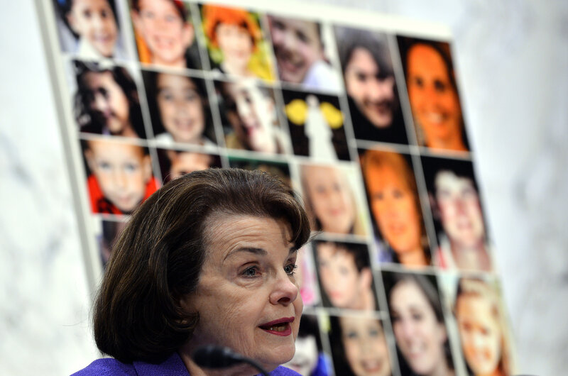 Pictures of the Sandy Hook Elementary School shooting victims are displayed as Democratic Sen. Dianne Feinstein of California speaks during at a 2013 Senate hearing. Wednesday's shooting in San Bernardino, which killed at least 14 people, was the deadliest since the 2012 shooting at Sandy Hook, which left 26 people dead. (Jewel Samad /AFP/Getty Images)