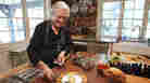Chef Jacques Pépin places silverware on a plate with an omelette at his home in Madison, Conn.