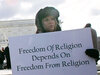 Activists hold posters during a March 2005 rally in front of the U.S. Supreme Court to support separation of church and state. The court heard two cases regarding whether Ten Commandments monuments should be displayed on government properties.