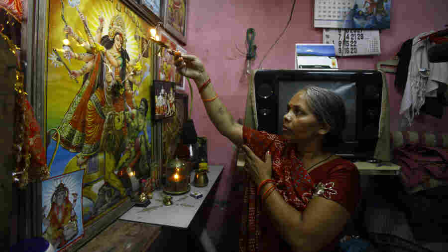 Usha Devi, who was treated for cervical cancer, prays at her house in Mumbai, India. Cervical cancer is one of the top four cancers in the developing world.