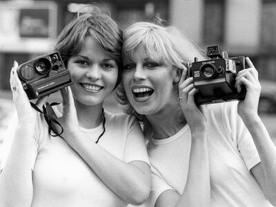 Do you and your friends look like these British models from the 1970s? If not, have no fear — you can still capture memories (digitally) in a shared private photo collection. (Manchester Daily Express/SSPL/Getty)