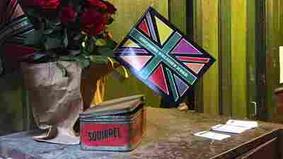 A flag reading "Refugees welcome here" greets visitors to London's Immigration Museum, located on Princelet Street in an East End building that housed immigrants from the early 18th century onward. Today the museum, in need of structural repairs, is open only on certain days and by appointment for groups.