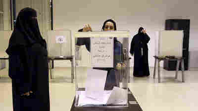 Saudi women vote at a polling center during municipal elections, in Riyadh, Saudi Arabia on Saturday. Saudi women are heading to polling stations across the kingdom, both as voters and candidates, for the first time in this landmark election.