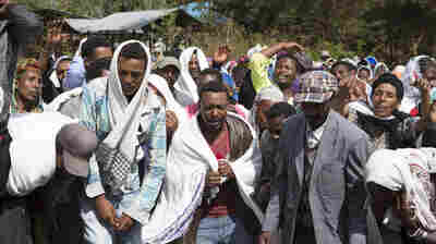 People mourn the death of Dinka Chala who was shot dead by the Ethiopian forces the day earlier, in the Yubdo Village, about 100 km from Addis Ababa in the Oromia region, on Dec. 17, 2015.