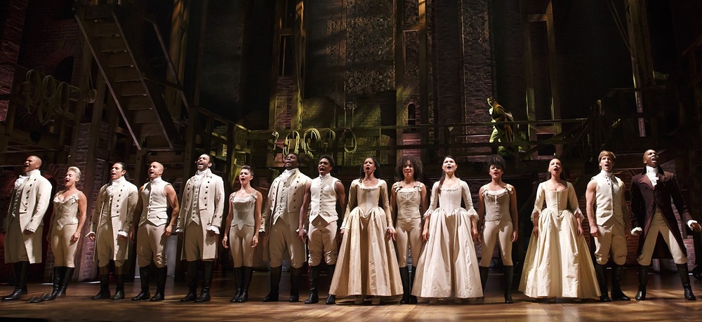 The Broadway cast of Hamilton, including Leslie Odom, Jr. (at far right) on stage at the Richard Rodgers Theatre.