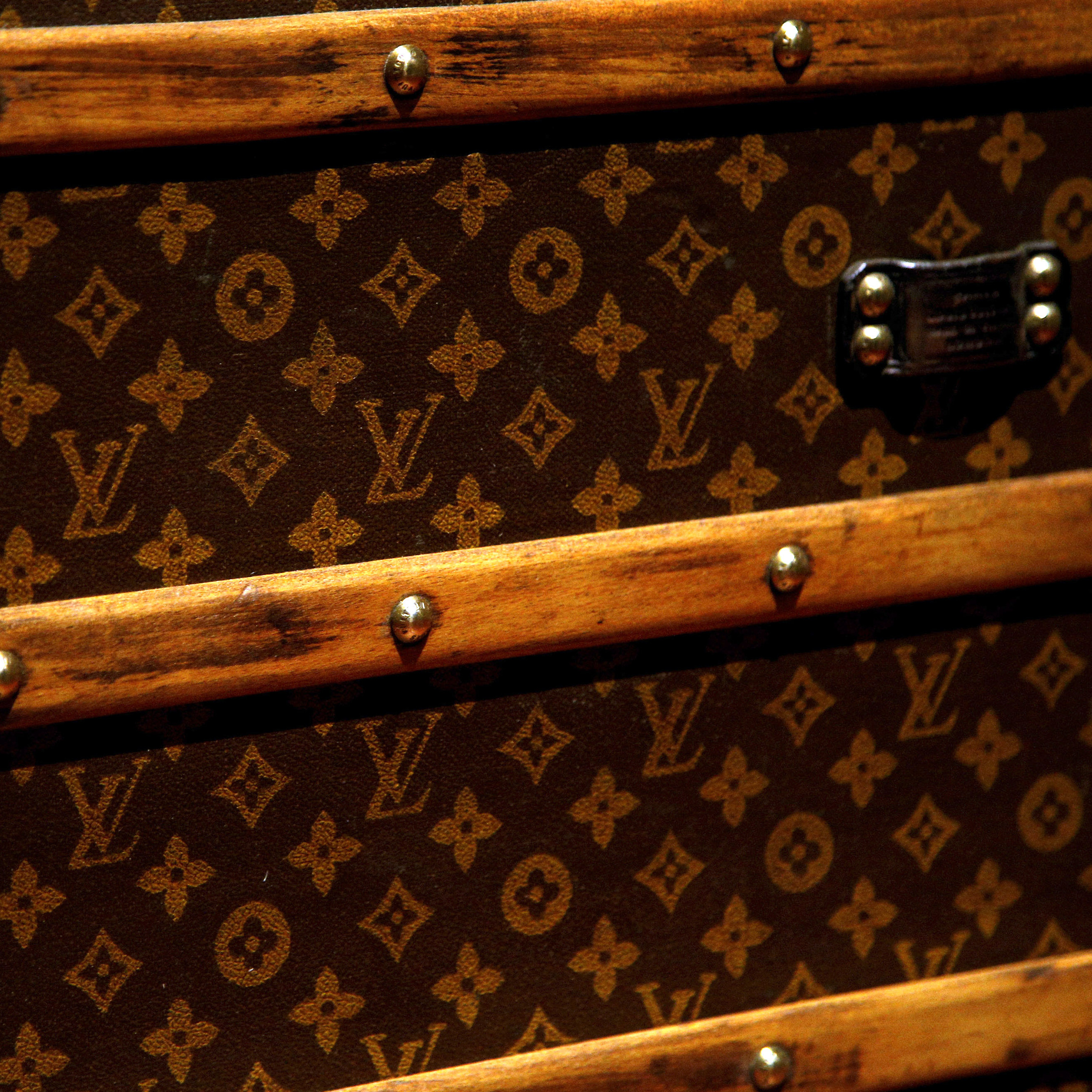 A trunk is displayed during the Louis Vuitton's exhibition "Fly, Sail, Travel" at the Grand Palais, in Paris, Thursday, Dec. 3, 2015.