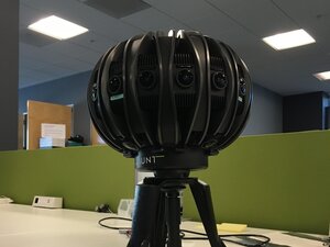 A camera developed by Jaunt VR features more than 12 lenses arrayed around a basketball-sized device. The device may be used to develop content for headsets built by three companies, all coming out in 2016.