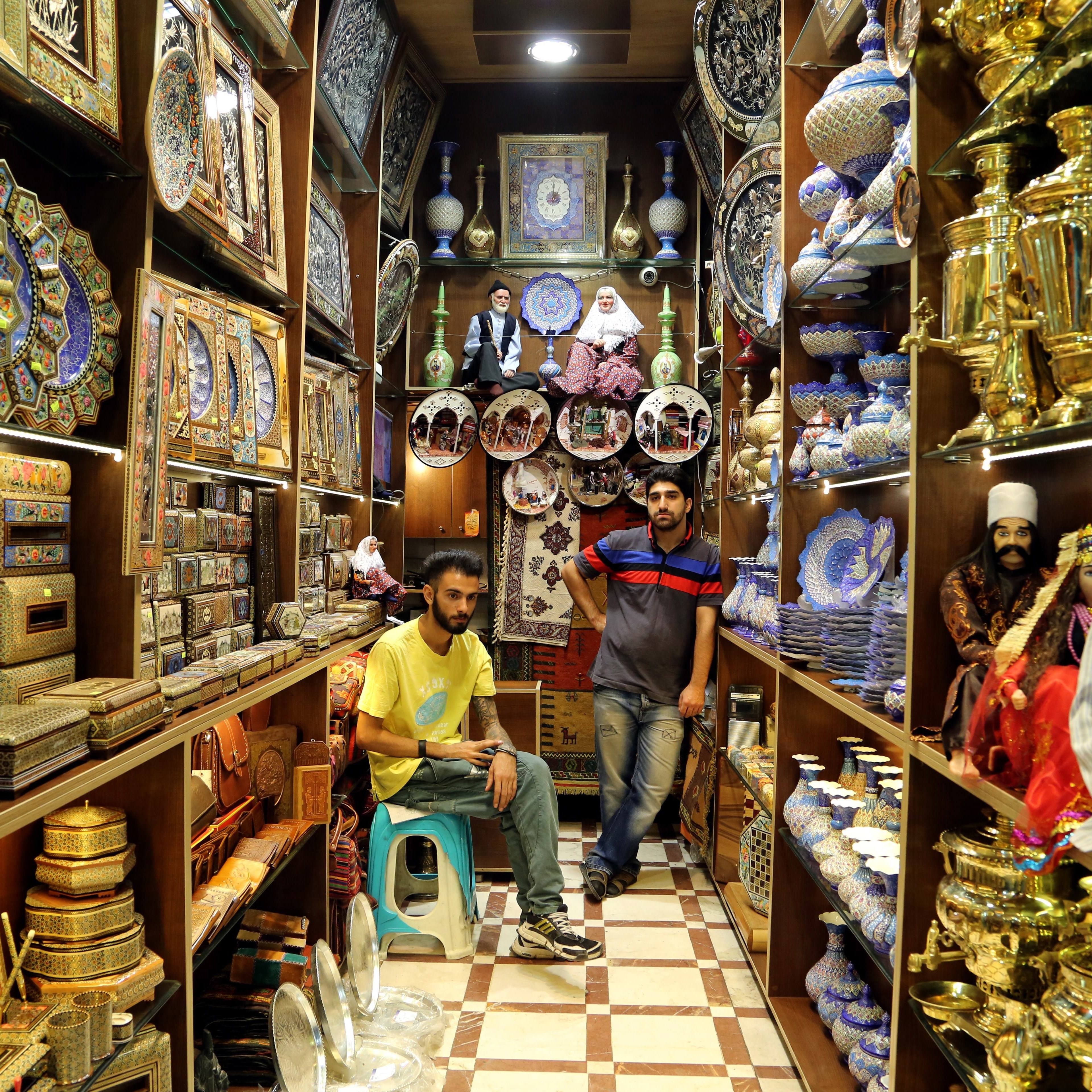 Iranian shopkeepers in the main bazaar in the capital, Tehran, in September. Iranians are eager for economic sanctions to be lifted and have been moving quickly to meet their obligations under a nuclear deal, according to analysts monitoring the agreement.