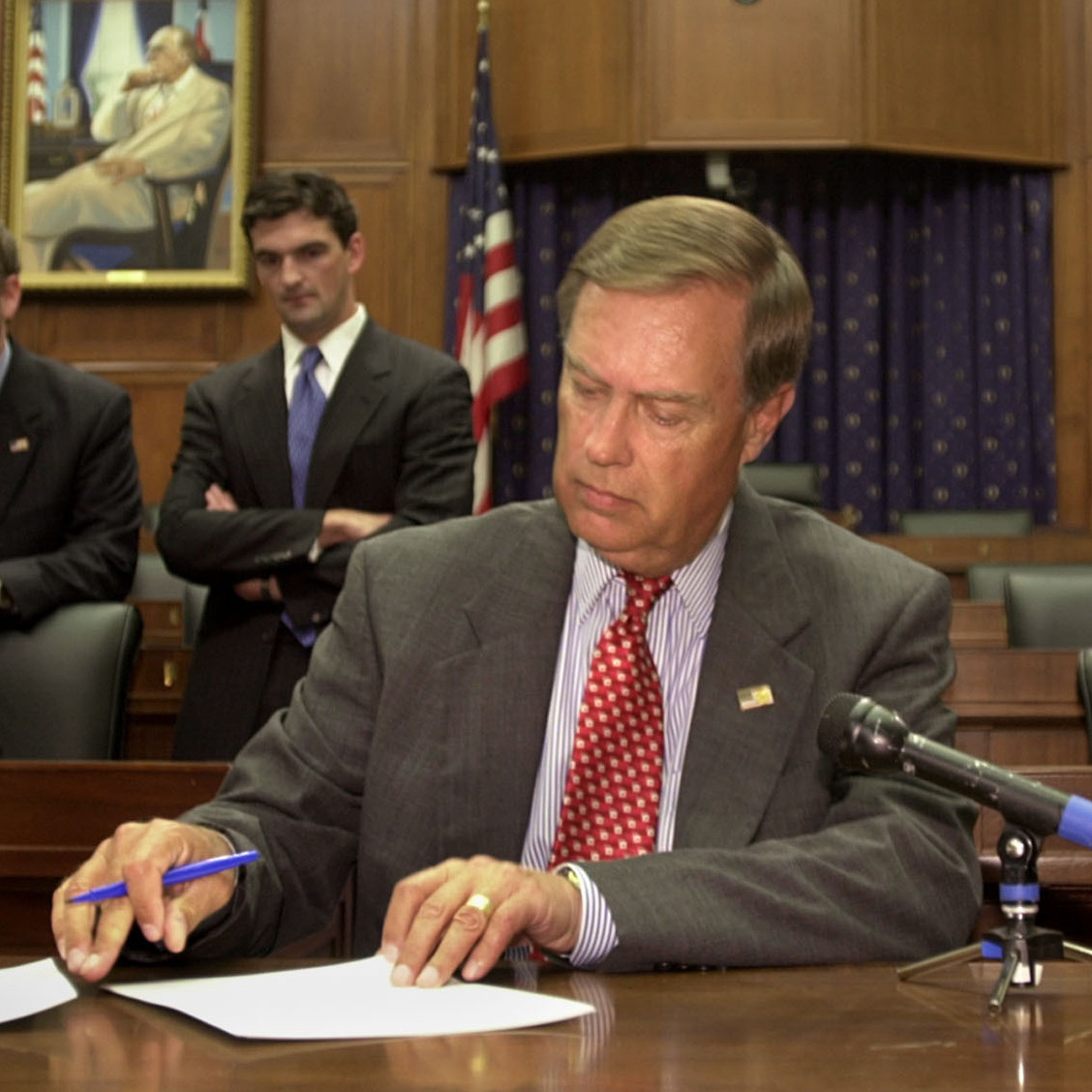 U.S. Rep. Michael Oxley, R-Ohio, signs subpoenas for WorldCom executives  in June 2002, ordering them to appear before the House Financial Services Committee. Oxley died Friday at the age of 71.