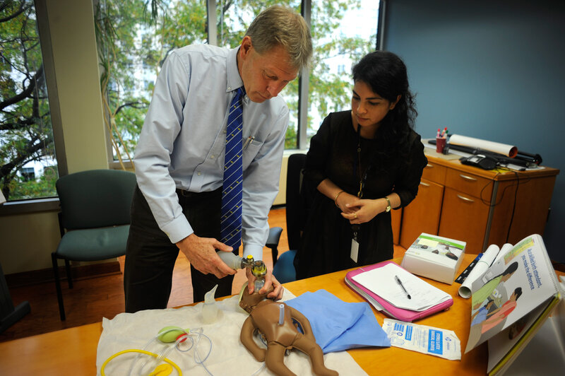 Baby "NeoNatalie" waits to be saved, as Dr. Mark Hathaway gives NPR's Malaka Gharib a lesson on getting an infant to take its first breath. (Akash Ghai/NPR) Baby "NeoNatalie" waits to be saved, as Dr. Mark Hathaway gives NPR's Malaka Gharib a lesson on getting an infant to take its first breath. (Akash Ghai/NPR)