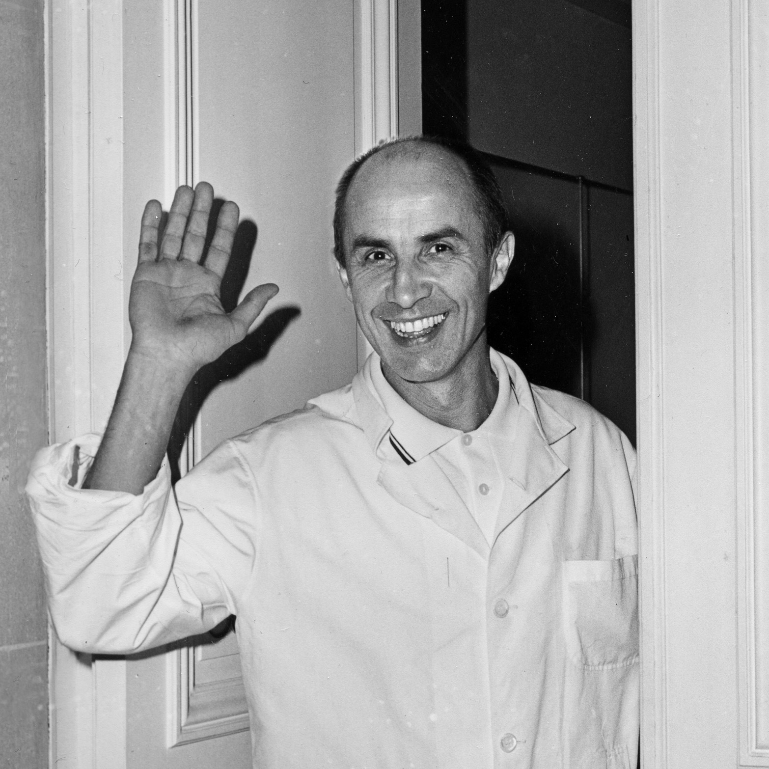 Andre Courrèges, Parisian fashion designer, waves at the door of his fashion house in Paris on Feb. 8, 1967. The designer has died at the age of 92.