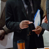 A job seeker views a business card during a Giant Job Fair last month in Detroit. During 2015, employers created 2.65 million new jobs.