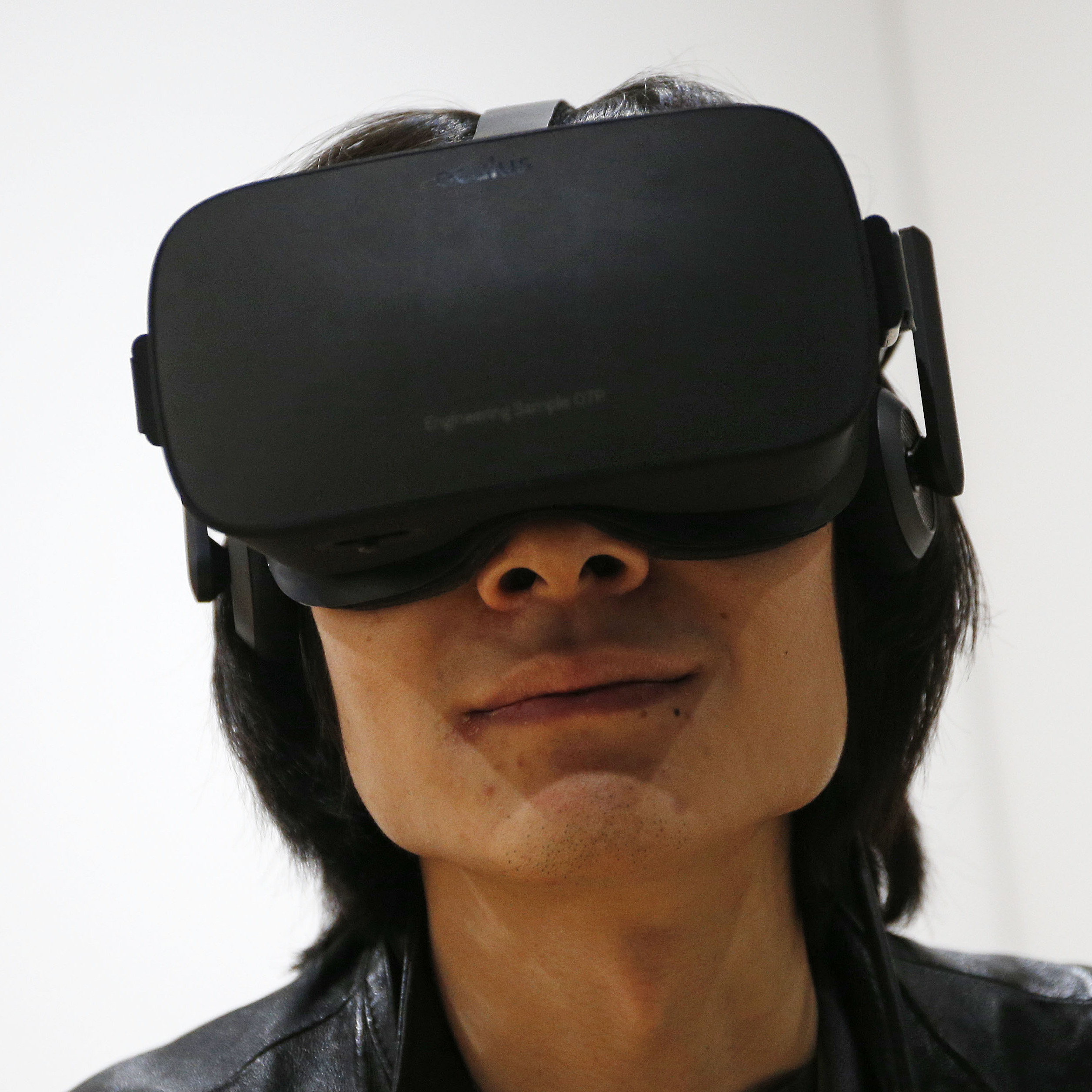 Peijun Guo wears the Oculus Rift VR headset at the Oculus booth at CES International, Wednesday, Jan. 6, 2016, in Las Vegas