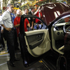 President Obama looks over a vehicle on the assembly line with autoworker Jeffrey Cook, during his tour of the Ford Motor Co. Chicago Assembly Plant in 2010.