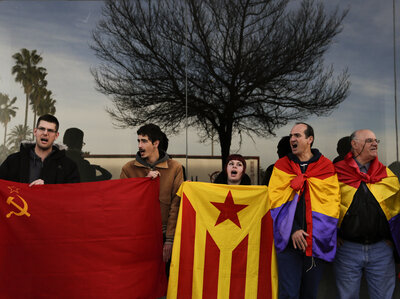 Anti-monarchy protesters gather Monday outside a makeshift courtroom after the arrival of Spain's Princess Cristina, in Palma de Mallorca.