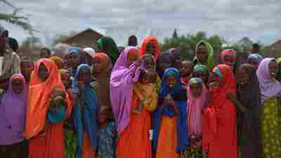 Somalis living in the Dadaab camp in Kenya gather to watch the arrival of the United Nations High Commissioner for Refugees last May.