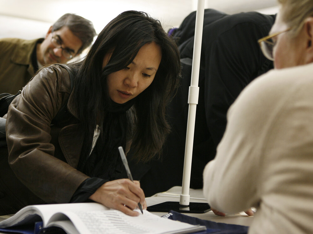 Tanya Lau signs in to vote at the Chinese Community Church in Washington in 2010. Voter turnout has been low among Asian-Americans in recent elections, but a new superPAC hopes to increase it. Tanya Lau signs in to vote at the Chinese Community Church in Washington in 2010. Voter turnout has been low among Asian-Americans in recent elections, but a new superPAC hopes to increase it.