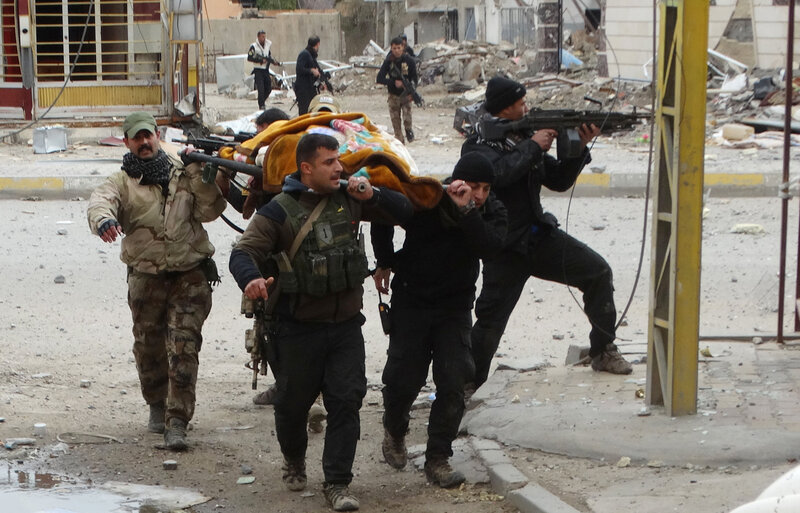 Iraqi security forces and allied Sunni tribal fighters evacuate an injured woman after she was shot by the Islamic State in Ramadi on Jan. 4. Iraqi forces have pushed ISIS out of much of Ramadi, but daily fighting is still taking place in the southeast part of the city, where ISIS is using civilians as human shields, according to the Iraqi military. Iraqi security forces and allied Sunni tribal fighters evacuate an injured woman after she was shot by the Islamic State in Ramadi on Jan. 4. Iraqi forces have pushed ISIS out of much of Ramadi, but daily fighting is still taking place in the southeast part of the city, where ISIS is using civilians as human shields, according to the Iraqi military.