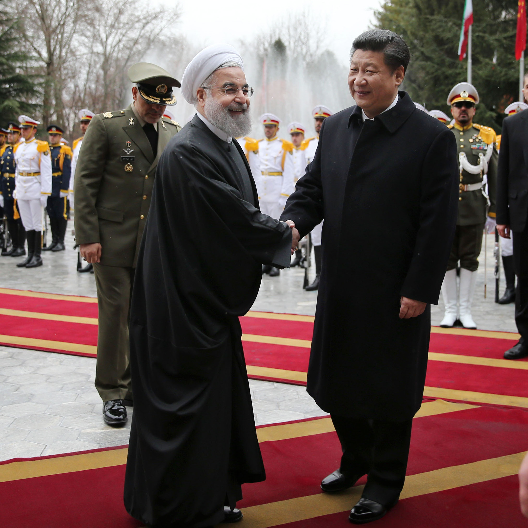 Iranian President Hassan Rouhani greets visiting Chinese President Xi Jinping at the Saadabad Palace in Tehran on Saturday. With sanctions lifted, the countries pledged to develop economic ties.