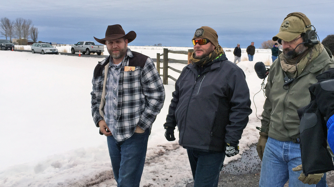 Ammon Bundy (left) approaches an FBI gate at the Burns Municipal Airport in Oregon on Friday. Bundy, the leader of an armed group occupying a national wildlife refuge to protest federal land policies, was among several people arrested Tuesday. Another member of the group was killed. Ammon Bundy (left) approaches an FBI gate at the Burns Municipal Airport in Oregon on Friday. Bundy, the leader of an armed group occupying a national wildlife refuge to protest federal land policies, was among several people arrested Tuesday. Another member of the group was killed.