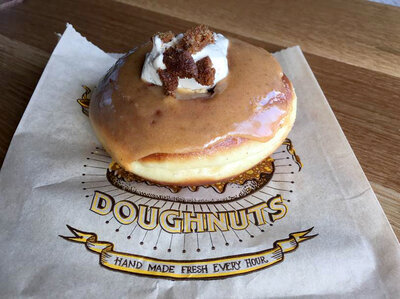 The Pumpkin Fool from Santa Monica, California's Sidecar Doughnuts & Coffee is a ring of delicious evil, and reporter Noah Nelson's personal downfall. If only its gastronomic virtues could be bundled into a virtual, guilt-free version. (Courtesy of Noah Nelson/Youth Radio) The Pumpkin Fool from Santa Monica, California's Sidecar Doughnuts & Coffee is a ring of delicious evil, and reporter Noah Nelson's personal downfall. If only its gastronomic virtues could be bundled into a virtual, guilt-free version. (Courtesy of Noah Nelson/Youth Radio)
