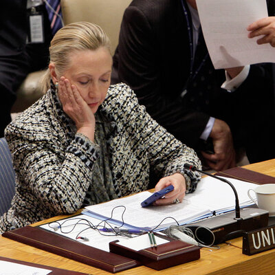 Hillary Clinton, then secretary of state, checks her cellphone after her address at a United Nations meeting in 2012.