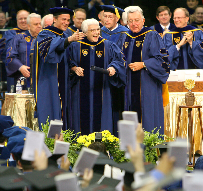 Lee and University of Notre Dame officials look out at the graduates of the class of 2006 as they hold up copies of To Kill a Mockingbird during commencement ceremonies. Notre Dame awarded Lee an honorary degree. (Matt Cashore/AP)