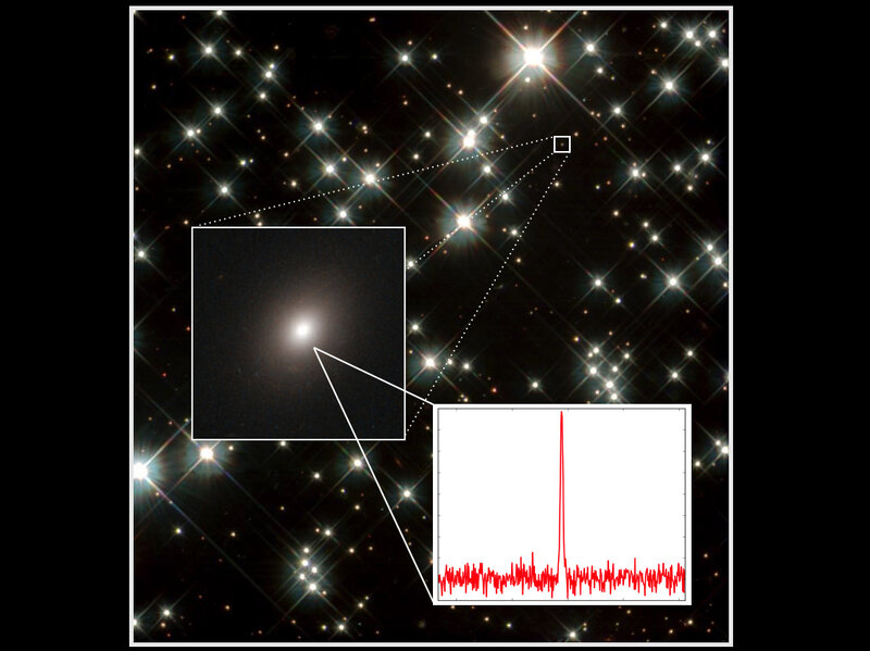 A zoomed-in view of an elliptical galaxy showing the Fast Radio Burst detected by the Parkes radio telescope in Australia. Observations made by the Australia Telescope Compact Array helped pinpoint which galaxy the pulse came from. (David Kaplan & Dawn Erb)