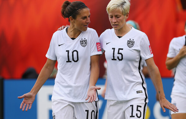 Carli Lloyd (left) and Megan Rapinoe are two of the five star players who filed a wage complaint against U.S. Soccer. The players say that the whole team supports their case, which accuses the national federation of paying male players far more money. Carli Lloyd (left) and Megan Rapinoe are two of the five star players who filed a wage complaint against U.S. Soccer. The players say that the whole team supports their case, which accuses the national federation of paying male players far more money.