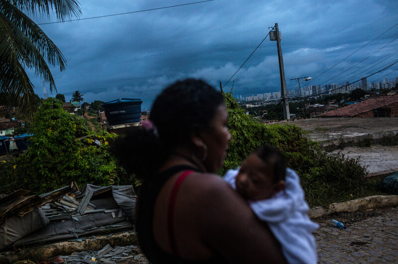 Nadja Bezerra carries her 4-month-old daughter, Alice, who was born with microcephaly, in Recife, Brazil.