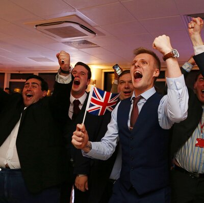 Advocates for the U.K. leaving the EU wave Union flags and cheer as the results come in at the Leave.EU referendum party at Millbank Tower in central London early Friday morning.