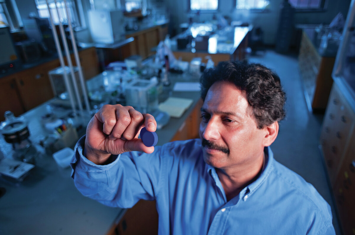 Professor Mas Subramanian looks at the blue pigment that was discovered at his lab in Oregon State University.