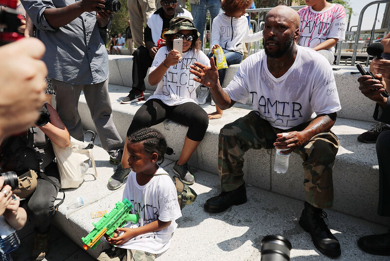 Crawford, joined by his daughter, speaks out against the shooting of 12 year-old Tamir Rice near the site of the Republican National Convention in downtown Cleveland. Crawford, joined by his daughter, speaks out against the shooting of 12 year-old Tamir Rice near the site of the Republican National Convention in downtown Cleveland.