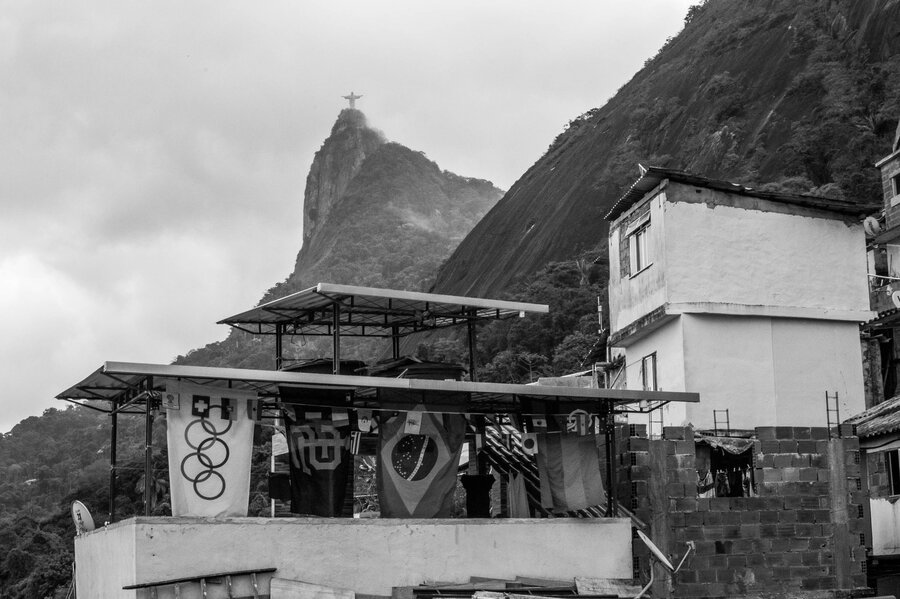 The Christ the Redeemer statue is visible above the Santa Marta favela in Rio de Janeiro. The Christ the Redeemer statue is visible above the Santa Marta favela in Rio de Janeiro.