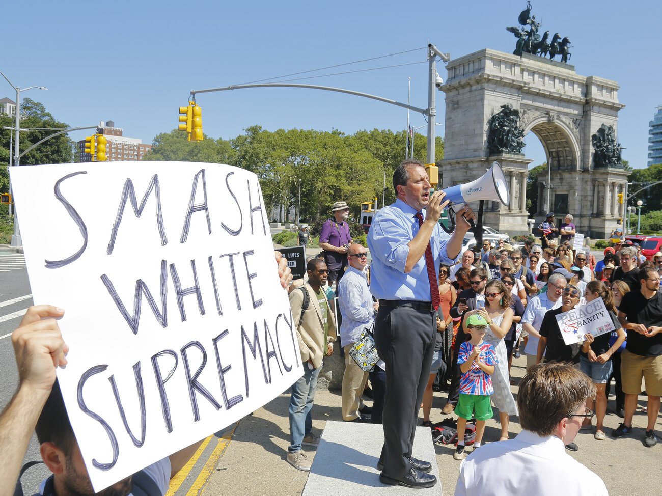 New York City Councilman Brad Lander addresses demonstrators Sunday in Brooklyn at a rally against the white nationalist violence in Charlottesville, Va., the day before.
(Bebeto Matthews/AP)