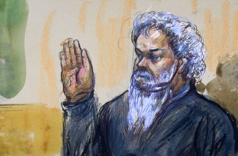 Ahmed Abu Khatallah is sworn in during a hearing at the federal U.S. District Court in Washington, D.C., in June 2014. He has pleaded not guilty to murder and terrorism charges related to the 2012 attack on the U.S. consulate in Benghazi, Libya. (Dana Verkouteren/AP)