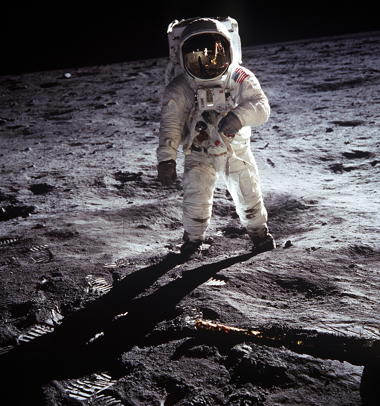 Astronaut Buzz Aldrin walks on the surface of the moon near the leg of the lunar module Eagle during the Apollo 11 mission. (Neil Armstrong/NASA)