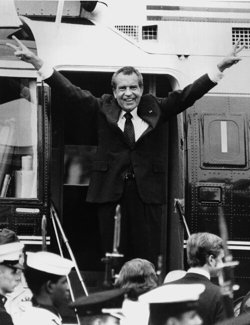 Richard Nixon says goodbye to his staff members outside the White House as he boards a helicopter after resigning the presidency on Aug. 9, 1974. (Bob Daughtery/AP)