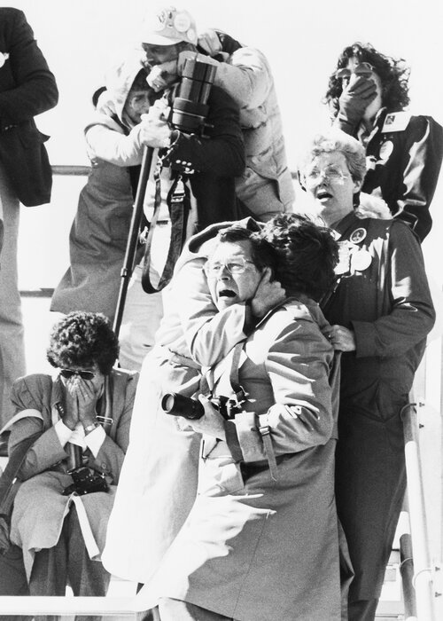 Spectators' faces register horror, shock and sadness after witnessing the explosion of the space shuttle Challenger 73 seconds after liftoff on Jan. 28, 1986. (Bettmann/Bettmann Archive)