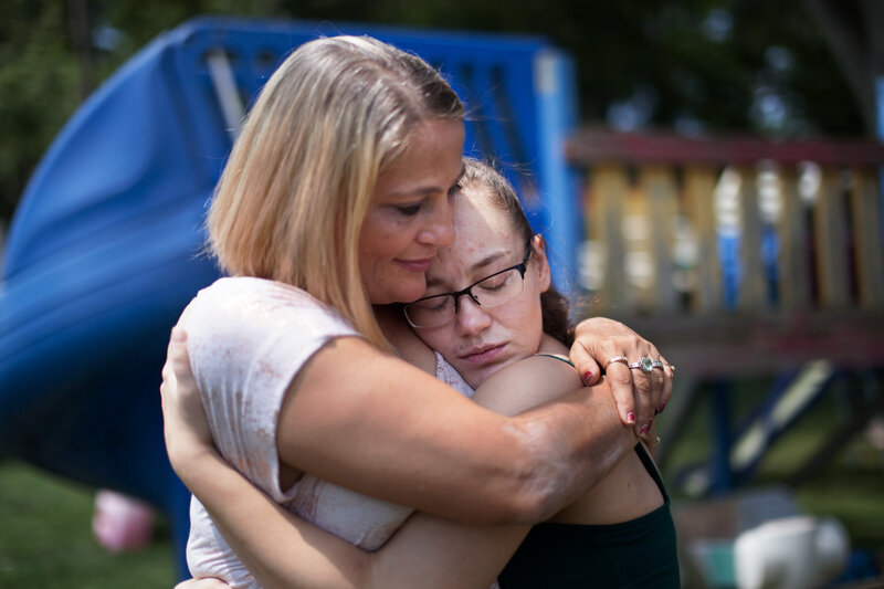 Destini Johnson gets a hug from her mother. She was released unexpectedly early because, she tells her parents, the jail was overcrowded. (Seth Herald for NPR)