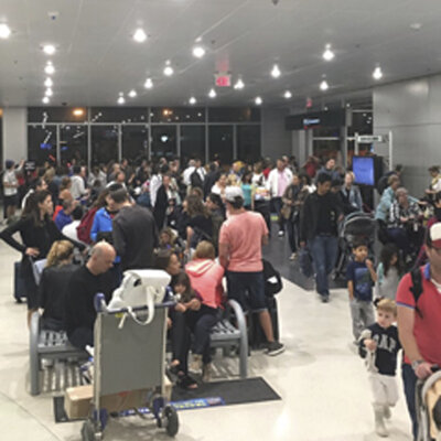 Miami's airport is packed on Thursday as residents and tourists evacuate the southern part of the state. (Shawn Woodward/AP)