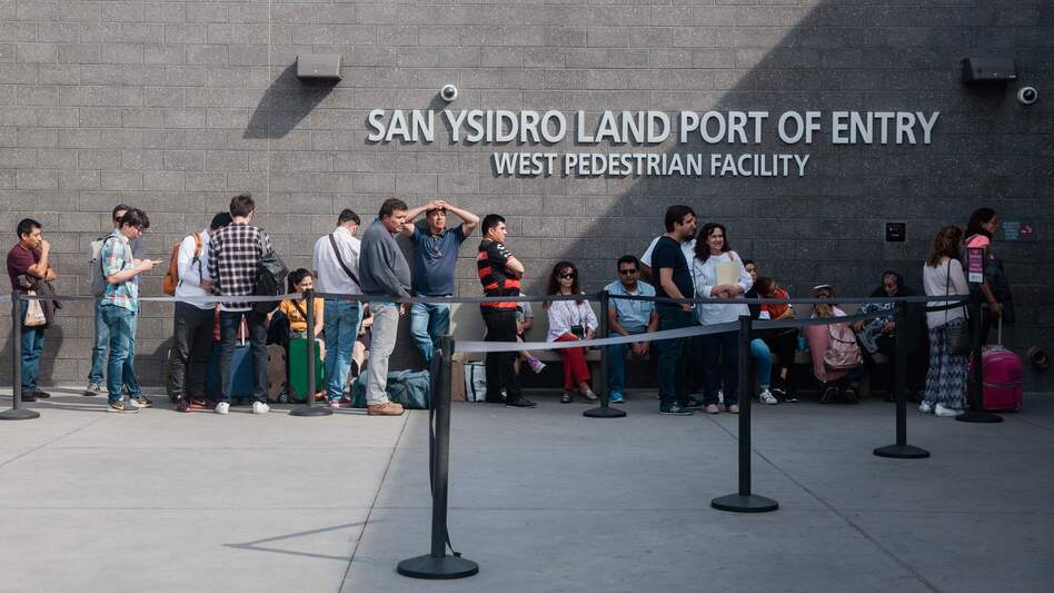People wait in line outside the San Ysidro Port of Entry, between Tijuana, Mexico, and San Diego, Calif., in October.
