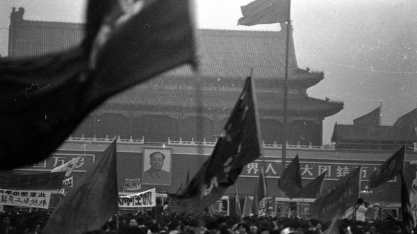 Protesters wave flags on Beijing