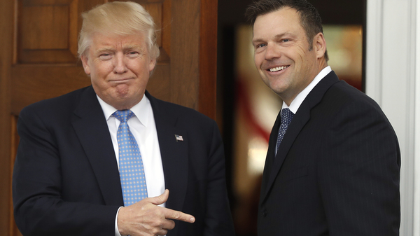 Former Kansas Secretary of State Kris Kobach is greeted by President Trump in 2016 at the Trump National Golf Club Bedminster clubhouse in Bedminster, N.J.