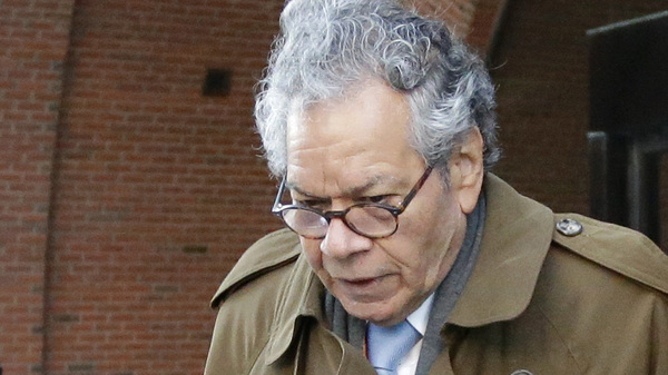 Insys Therapeutics founder John Kapoor departs federal court in Boston, Jan. 30. On Monday the company filed for Chapter 11 bankruptcy, saying it needs to sell its assets to pay back creditors. Kapoor, who was convicted last month of racketeering, owns more than 63% of the company.