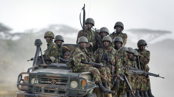 Kenyan army soldiers ride in a vehicle at their base in 2012. On Saturday, authorities in Kenya blamed Somali militant group al-Shabab for a blast that reportedly left 10 police officers dead.