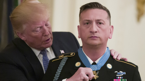 President Donald Trump presents the Medal of Honor to retired Army Staff Sgt. David Bellavia in the East Room of the White House on Tuesday. Bellavia received the award for conspicuous gallantry while serving in support of Operation Phantom Fury in Fallujah, Iraq in 2004.