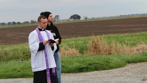 Rev. Matthew Barzare of St. Anne Church in Cow Island, La., on Saturday, just before a crop duster plane sprinkled 100 gallons of holy water across the community.