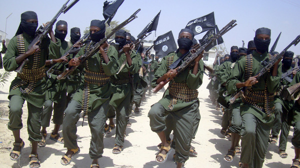 Al-Shabab fighters march with their weapons during military exercises on the outskirts of Mogadishu, Somalia, in 2011.