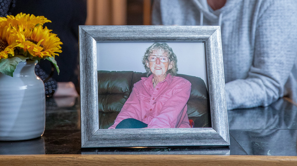 June (left) and Mary Kelly with a photo of their mother, Marilyn Kelly. Marilyn was living at Our House Too, in Rutland, Vt., before she died.